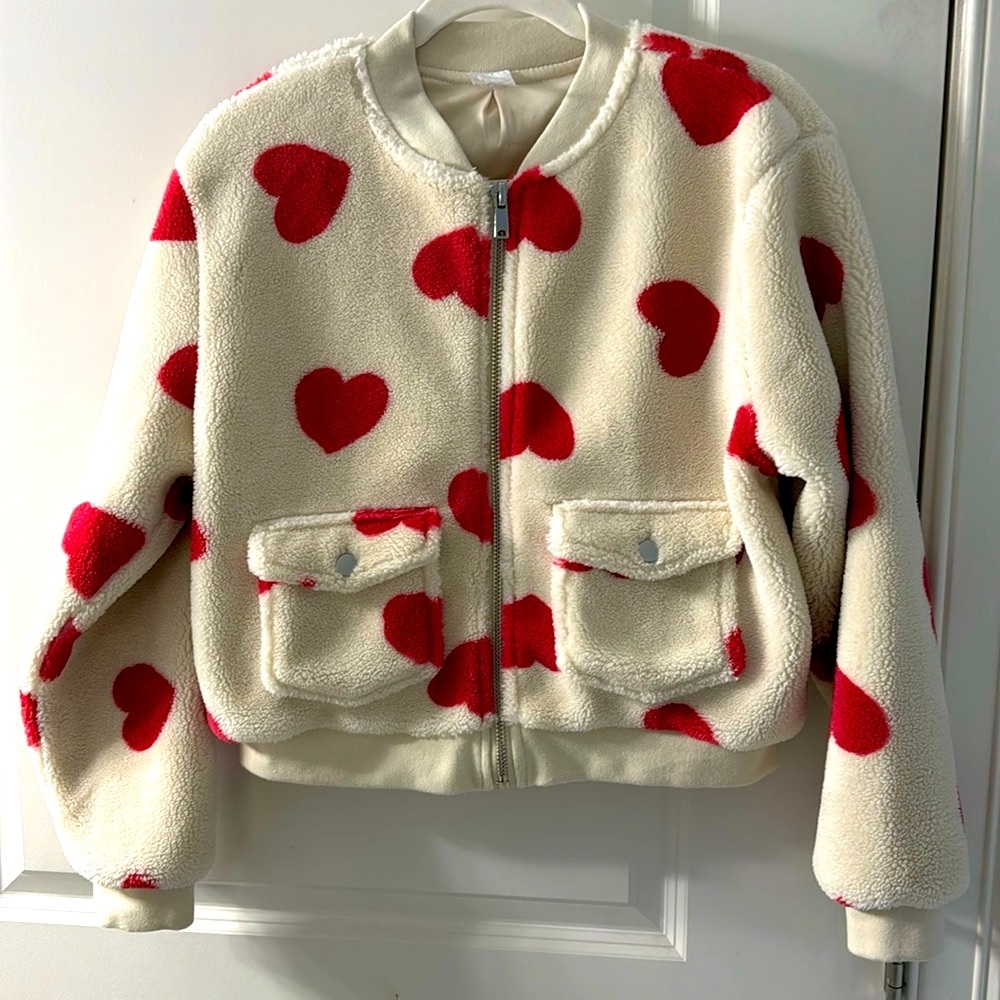 White Sherpa bomber style jacket with pink/red hearts